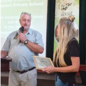 Nadia Coward presenting a certificate at the Ezemvelo KZN Wildlife Honorary Officers AGM held at Mtunzini Primary School.